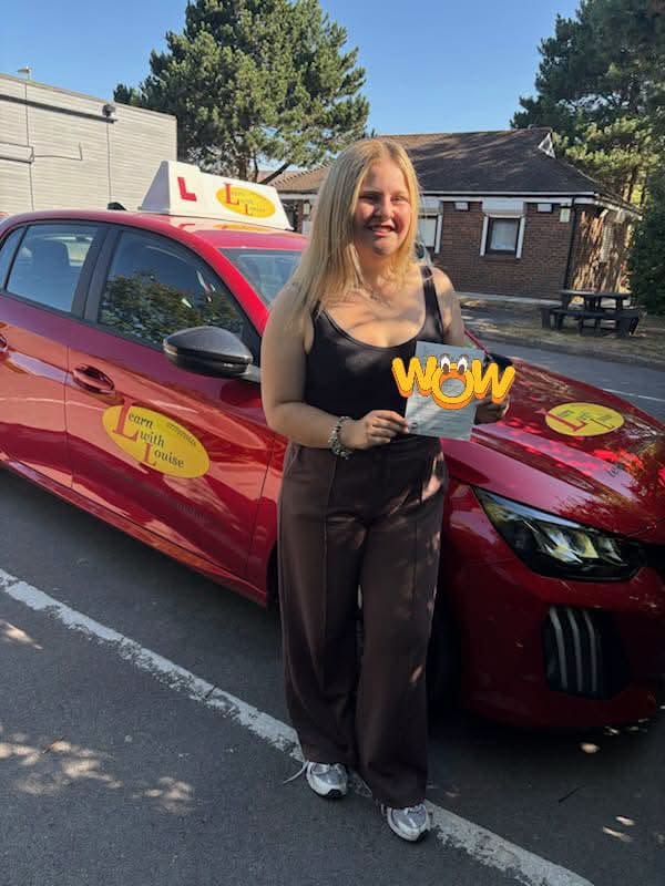 Ellie celebrating passing their driving test with Learn with Louise