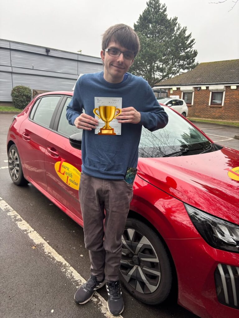 Joshua celebrating passing their driving test with Learn with Louise
