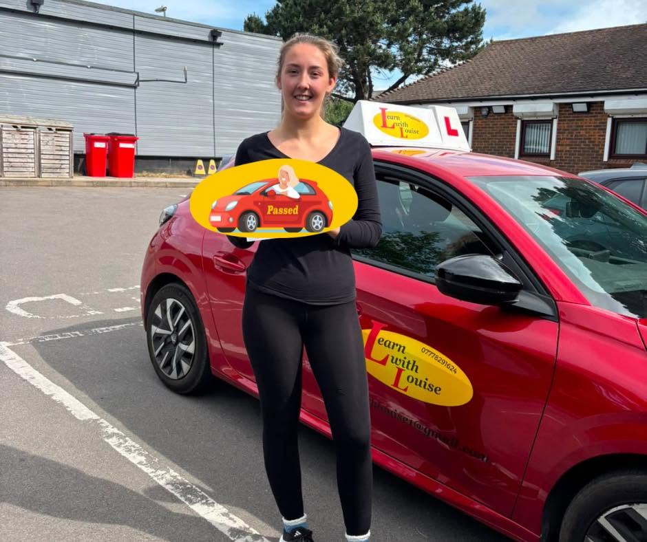 Keeley celebrating passing their driving test with Learn with Louise