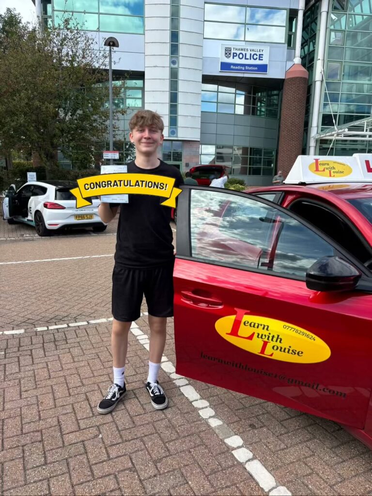Luke celebrating passing their driving test with Learn with Louise