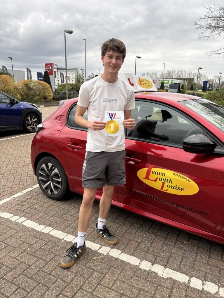 Sam celebrating passing their driving test with Learn with Louise