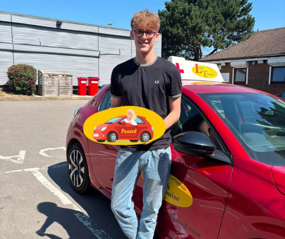 Thomas celebrating passing their driving test with Learn with Louise
